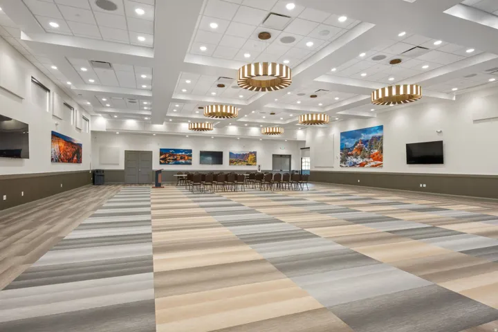 Building lobby featuring recessed lighting, a wainscoted wall, and high coffered ceiling