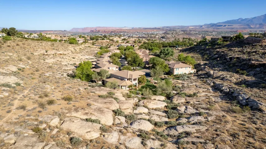 Bird's eye view of a mountain backdrop and a desert landscape