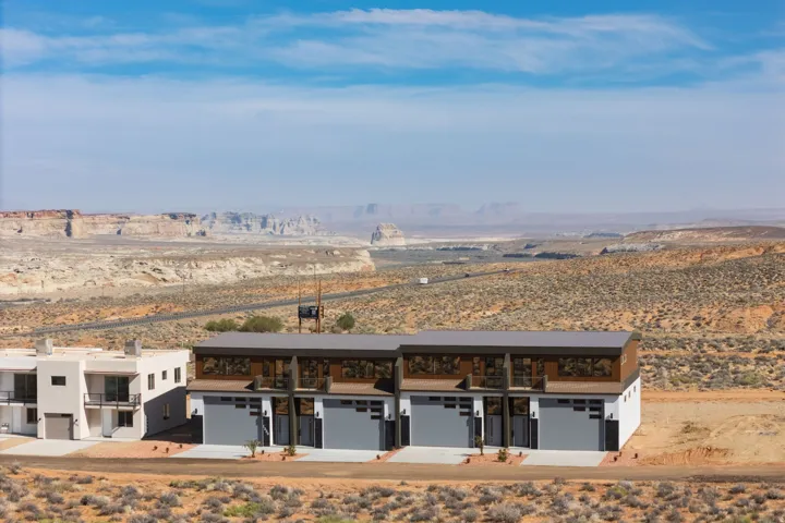 View of property with a desert view