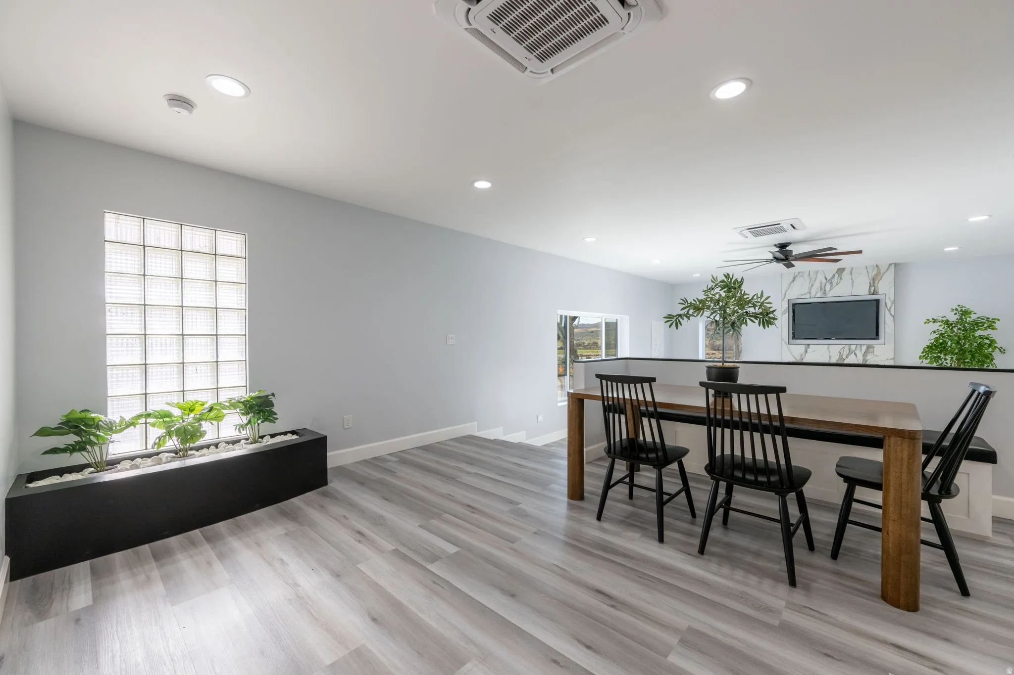 Dining area featuring light wood-style flooring, recessed lighting, and ceiling fan