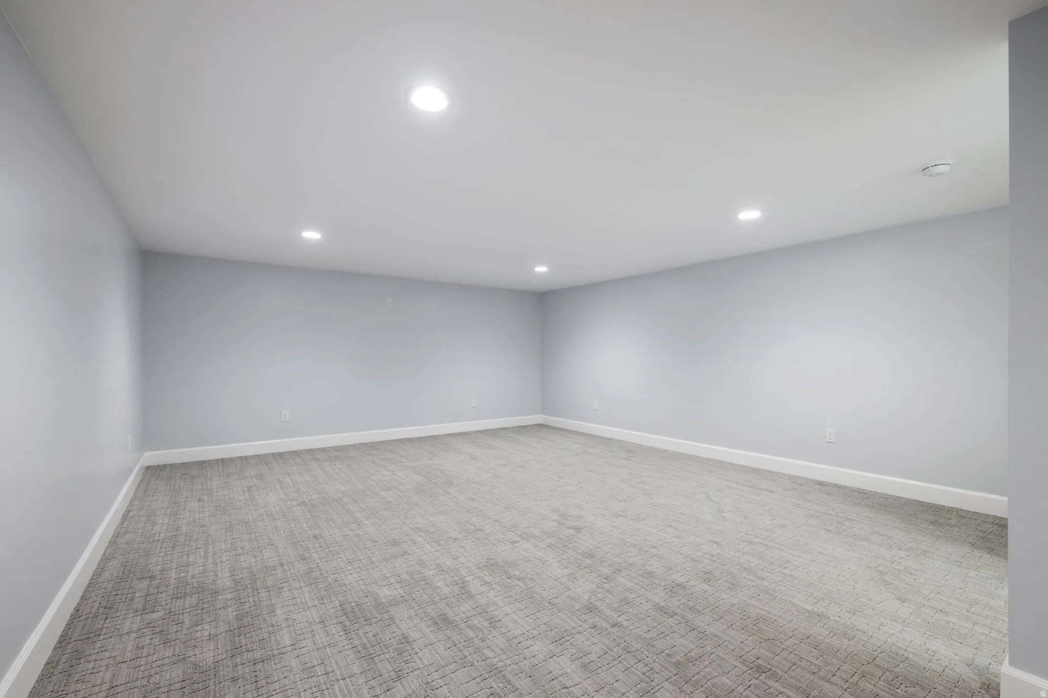 Spare room with carpet floors and recessed lighting