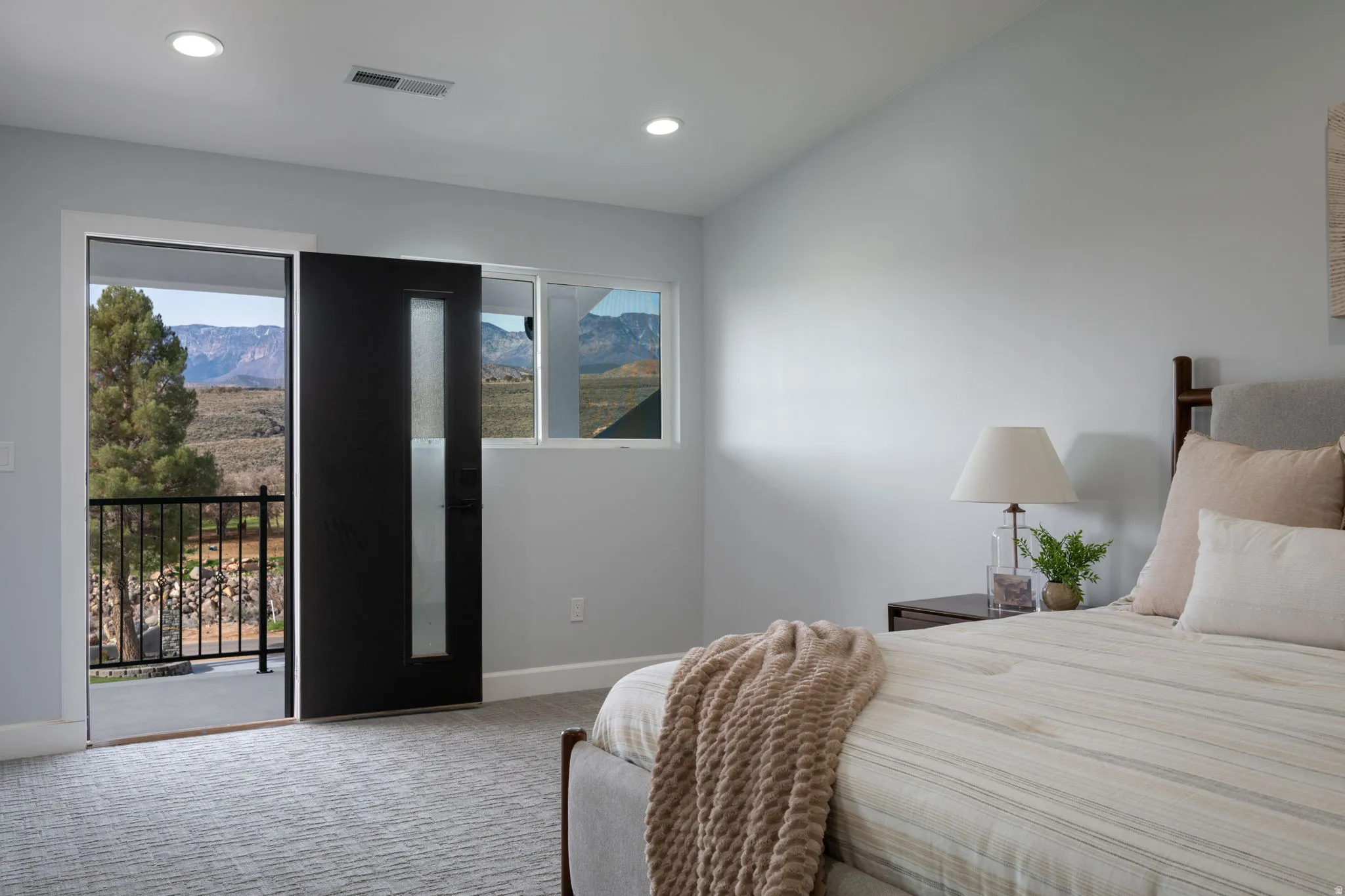 Bedroom featuring access to exterior, carpet flooring, recessed lighting, and a mountain view