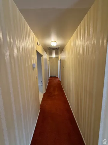Corridor with dark carpet