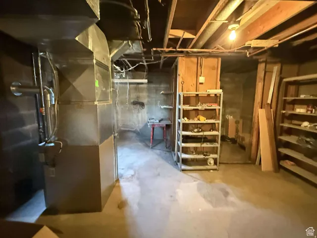Unfinished below grade area with heating unit