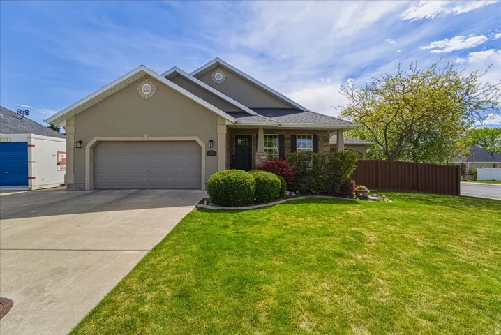 Beautiful Rambler, on a corner lot, cedar fencing, and a generous RV pad. Great curb appeal!