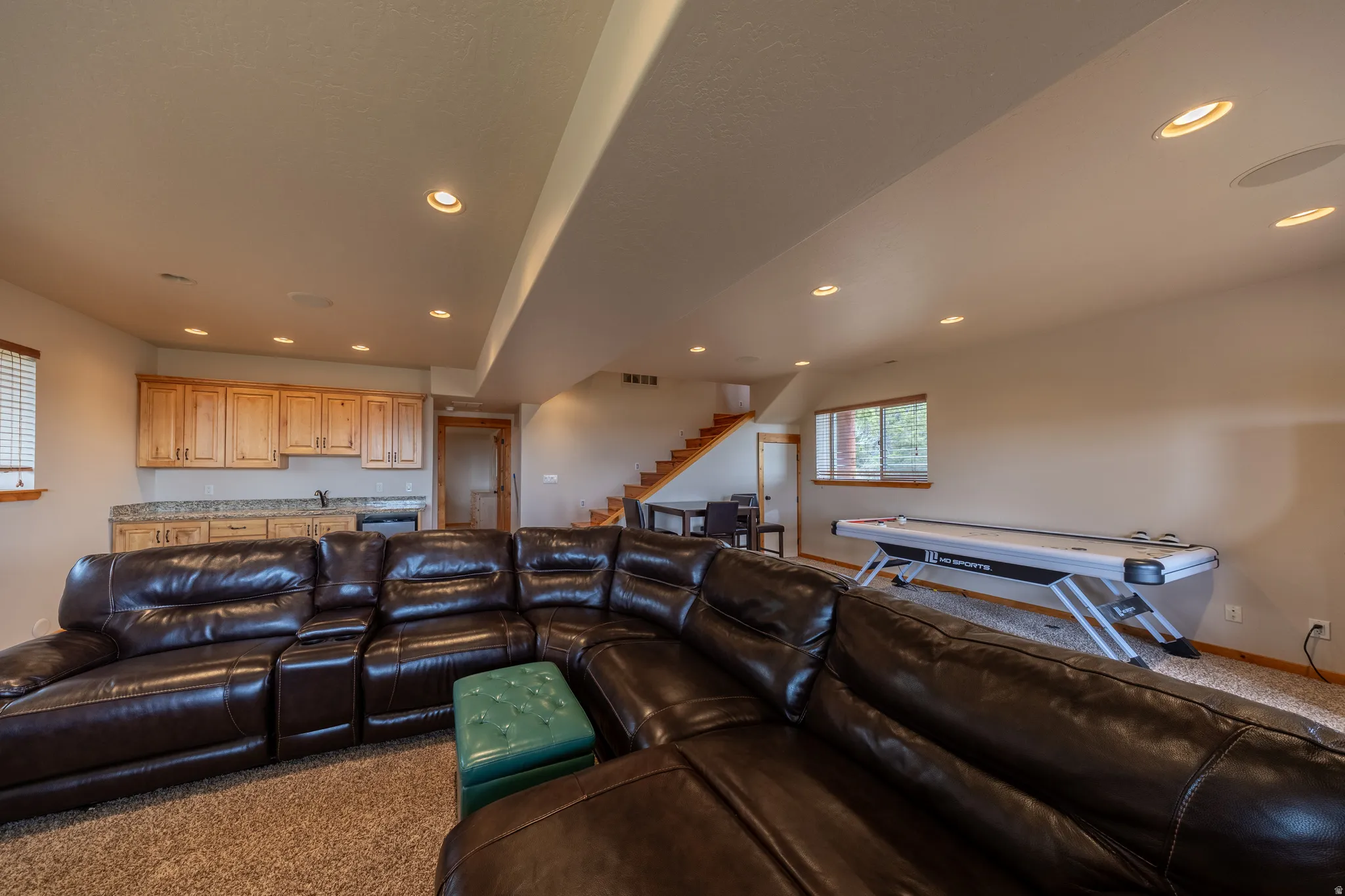 Living room featuring carpet floors and recessed lighting
