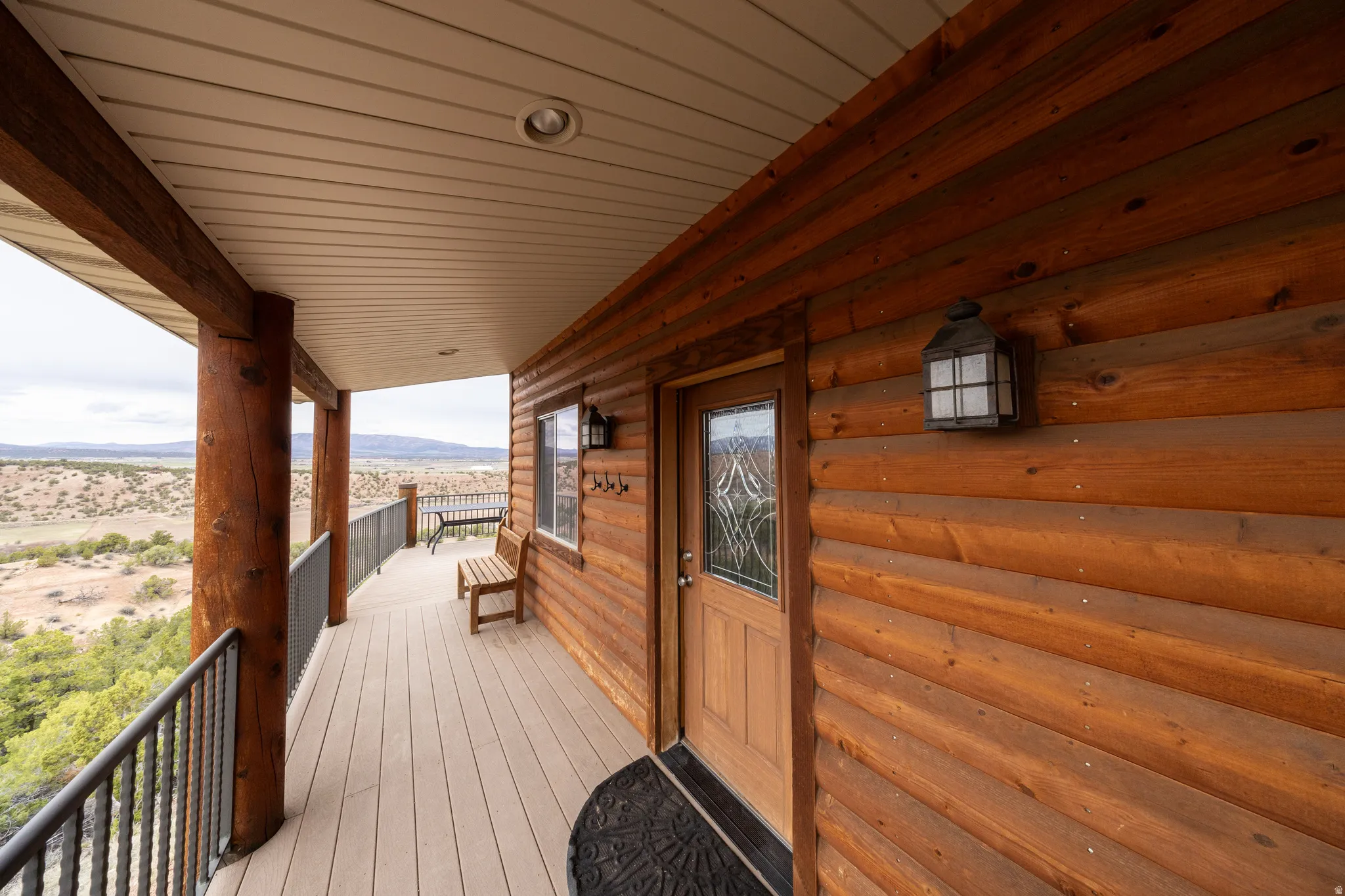 Wooden terrace featuring a mountain view