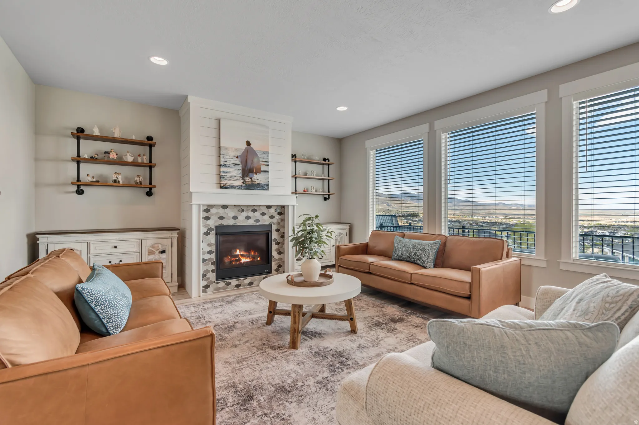 Living room with a fireplace and recessed lighting