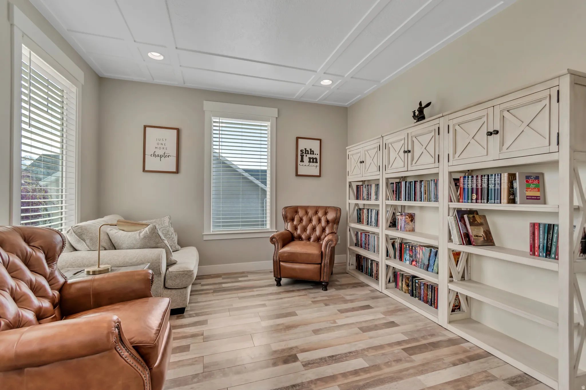 Sitting room featuring light wood-style flooring and recessed lighting
