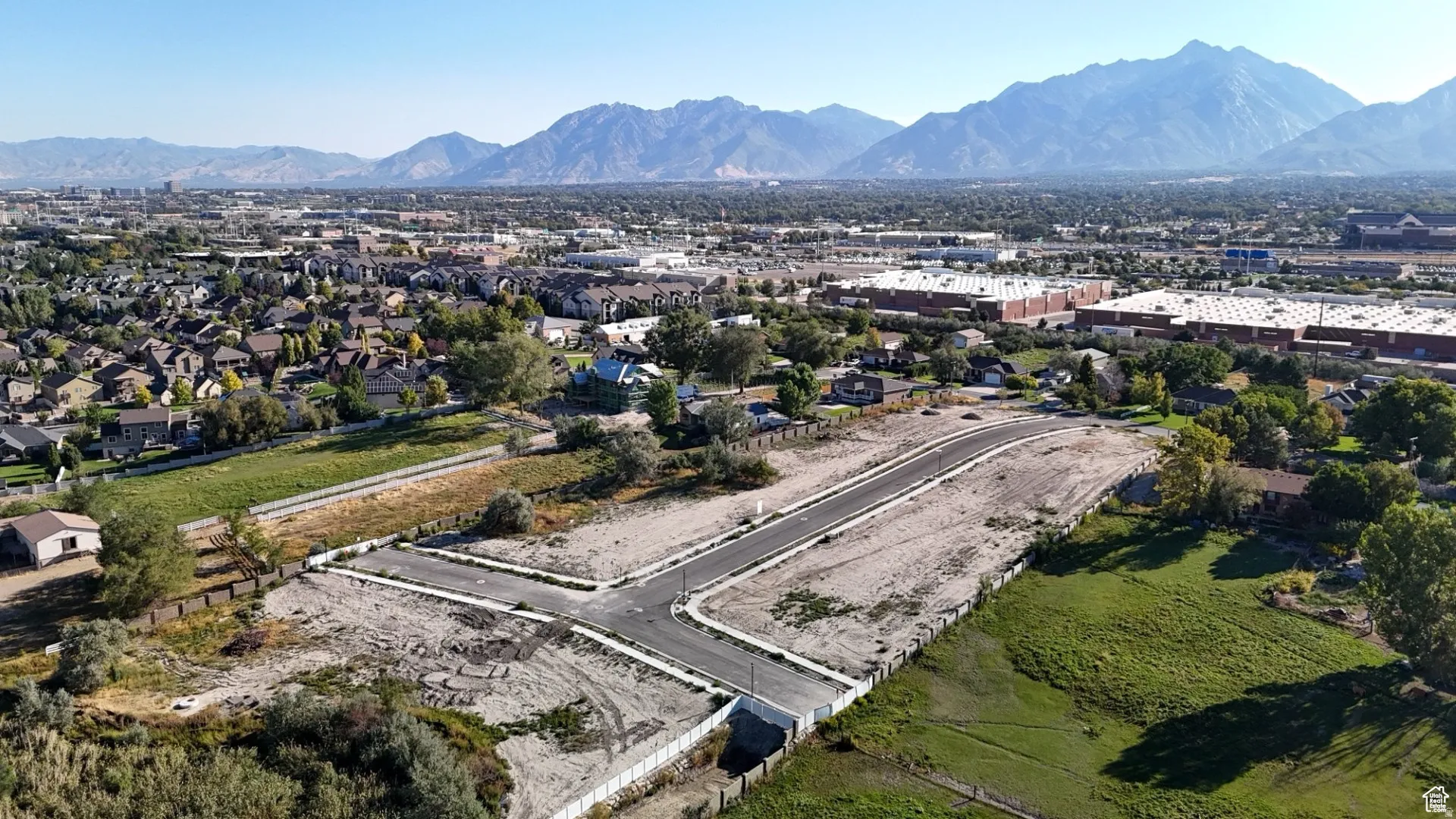Aerial view of residential area with a mountainous background