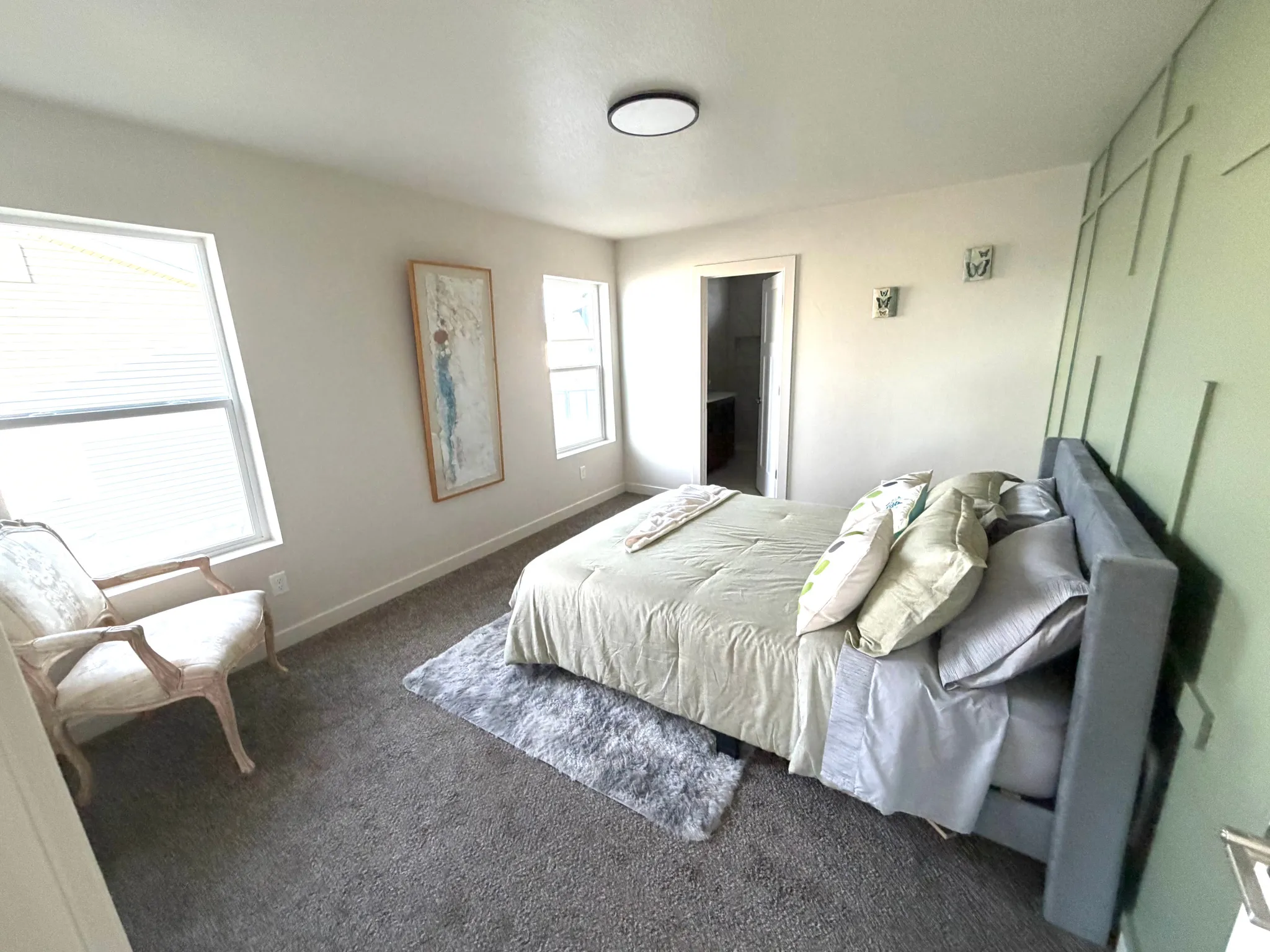Carpeted bedroom with baseboards