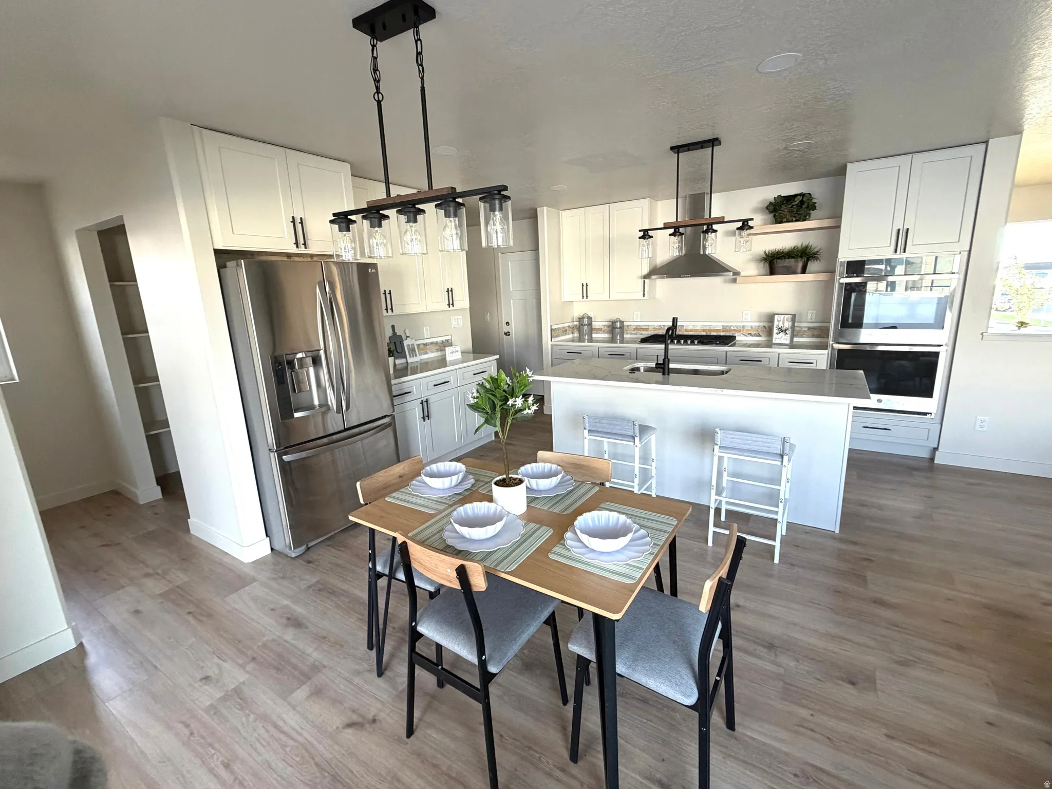 Dining space with baseboards and light wood-style flooring
