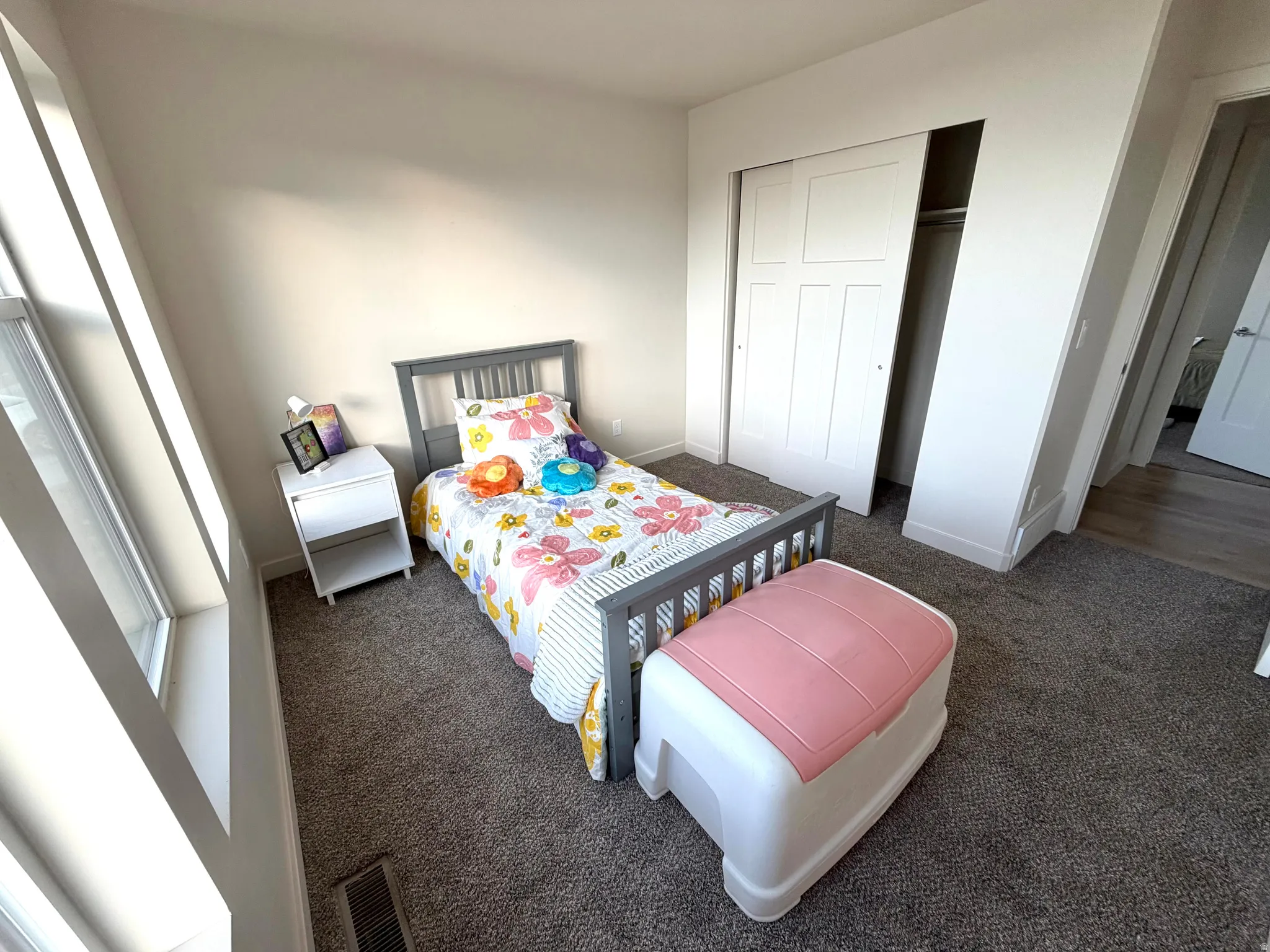 Bedroom featuring a closet and carpet flooring