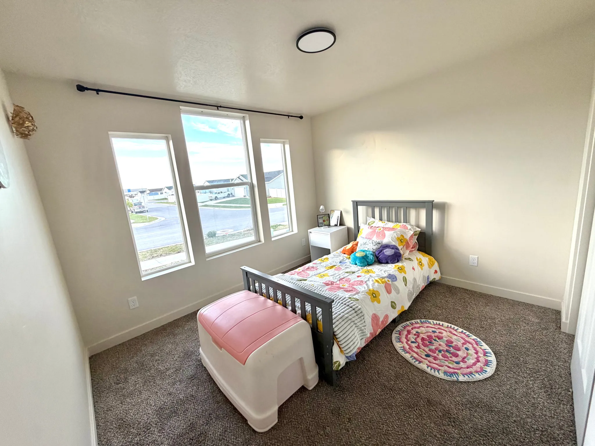 Bedroom featuring carpet flooring and a water view
