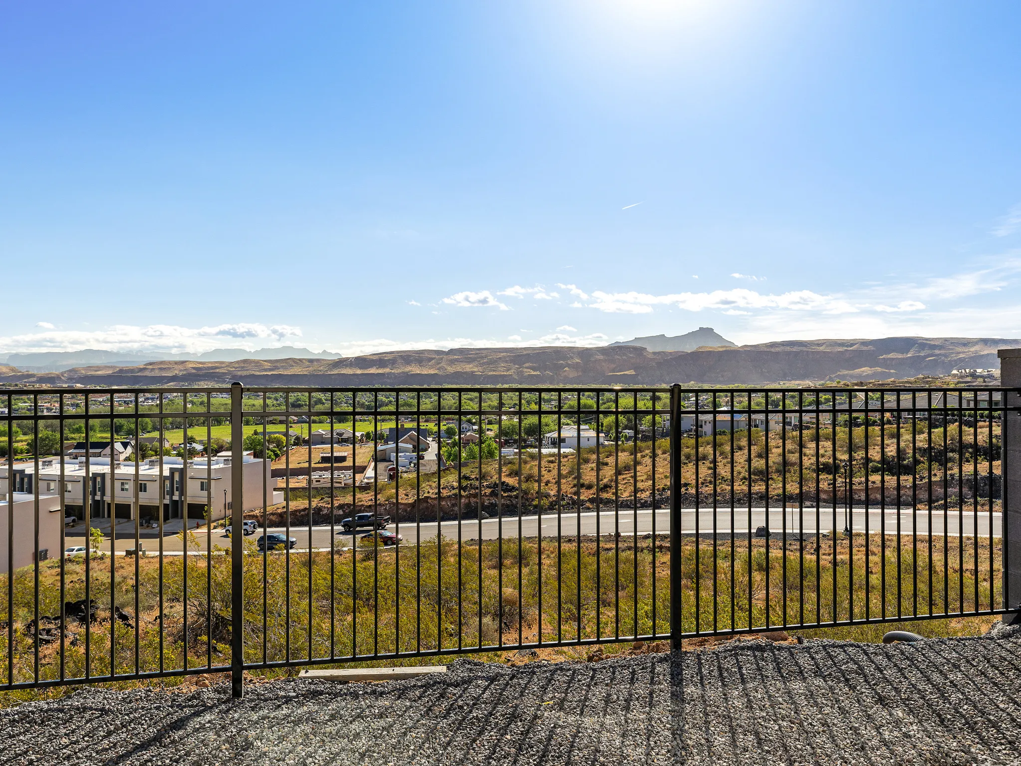 View of yard with a mountain view and a balcony