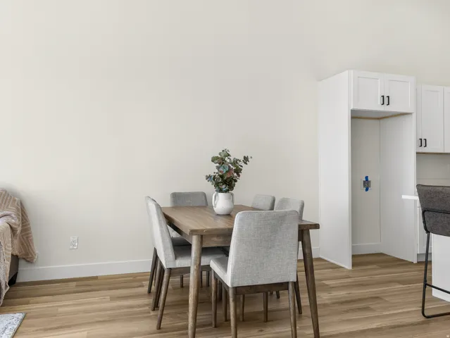 Dining space featuring light wood-style floors and baseboards