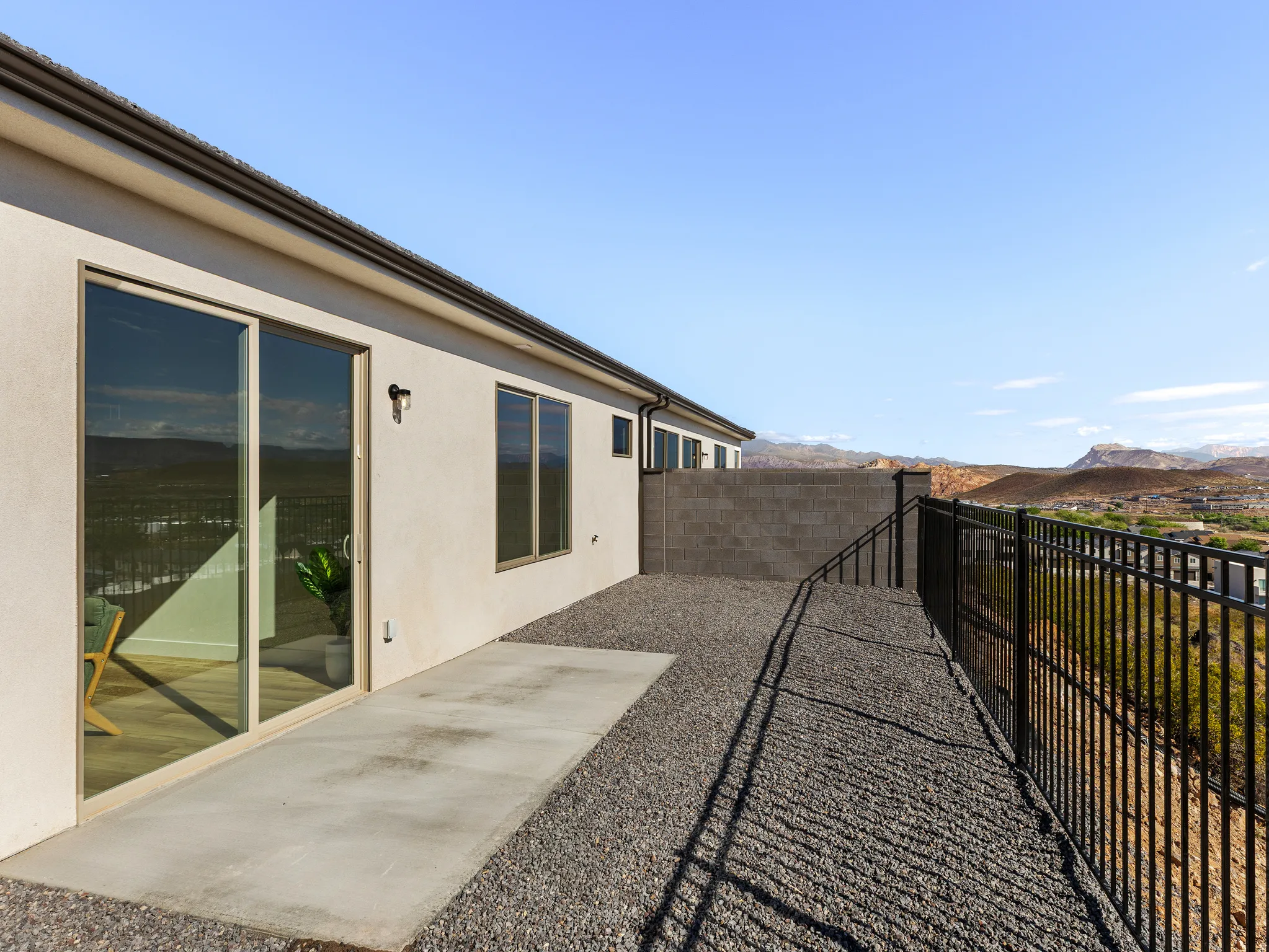 Fenced backyard featuring a patio and a mountain view