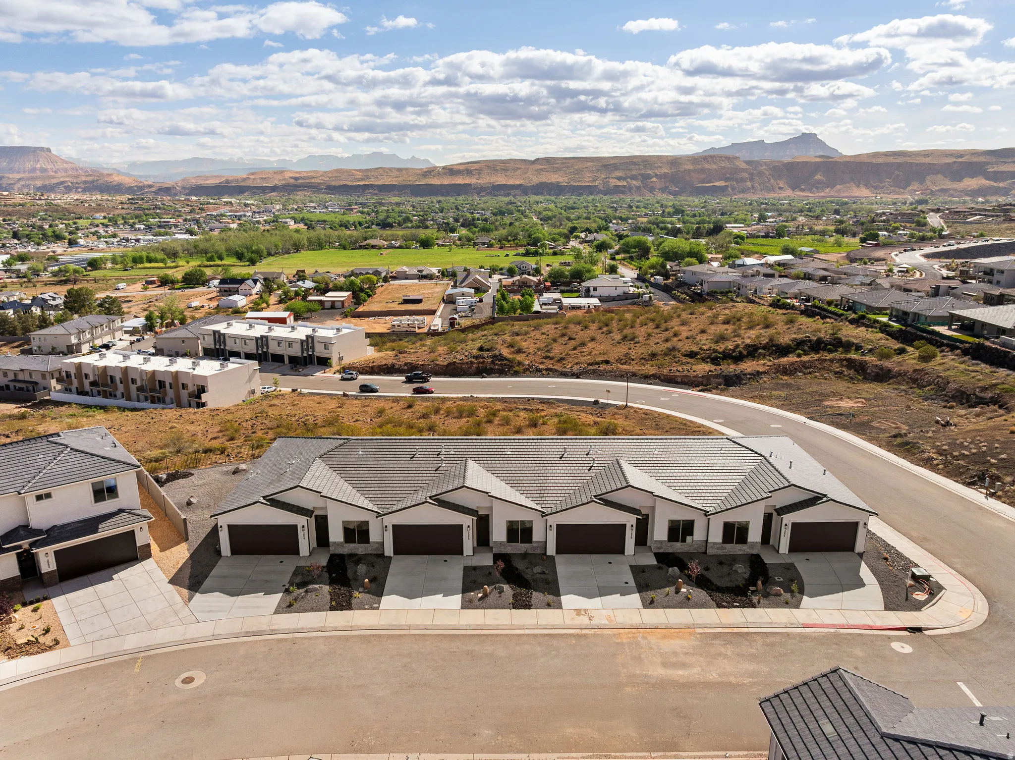 Aerial view of residential area featuring a mountain backdrop