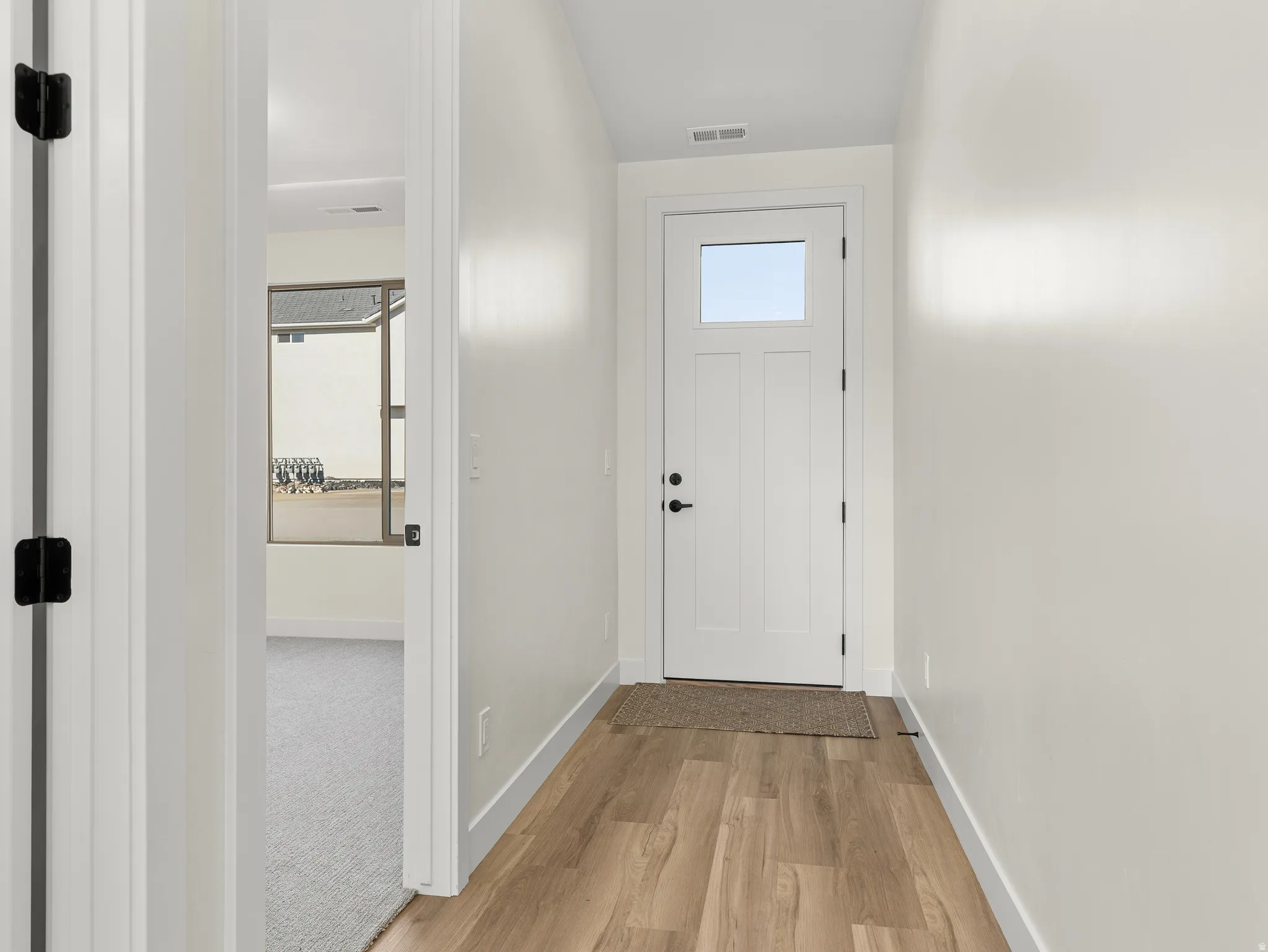Entryway featuring wood finished floors and plenty of natural light