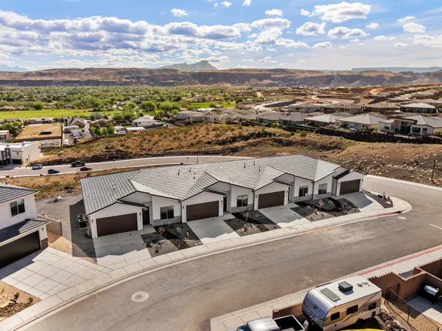 Aerial view of residential area with a mountainous background