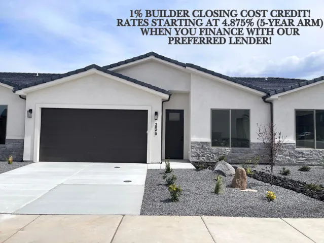 Contemporary exterior featuring a white stucco facade with stone accents