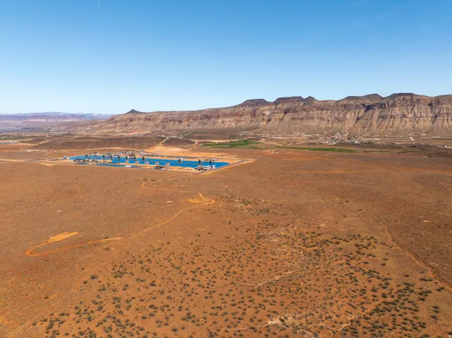 Aerial view of a mountainous background and a desert landscape