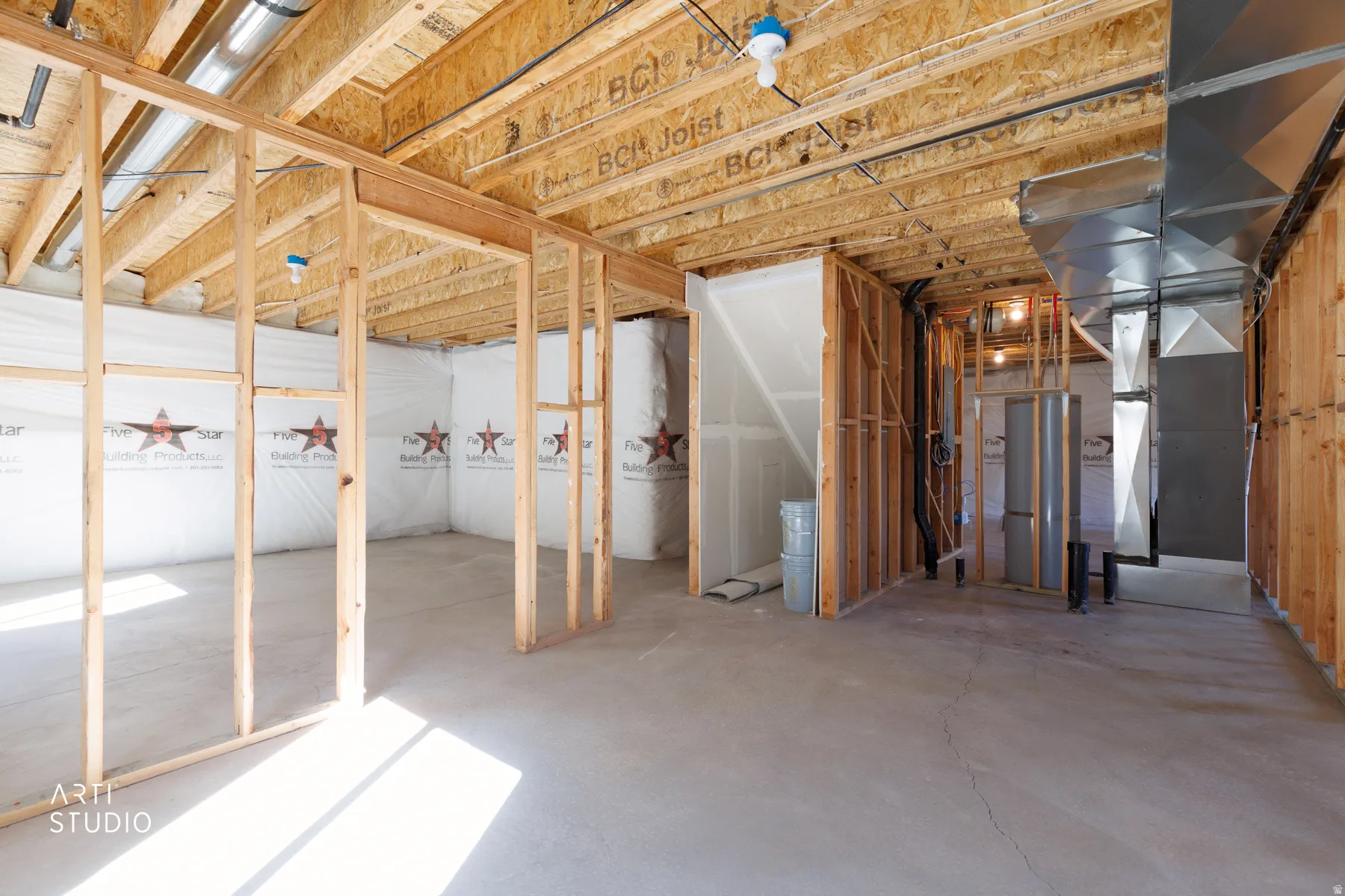 Unfinished basement area with water heater and heating unit