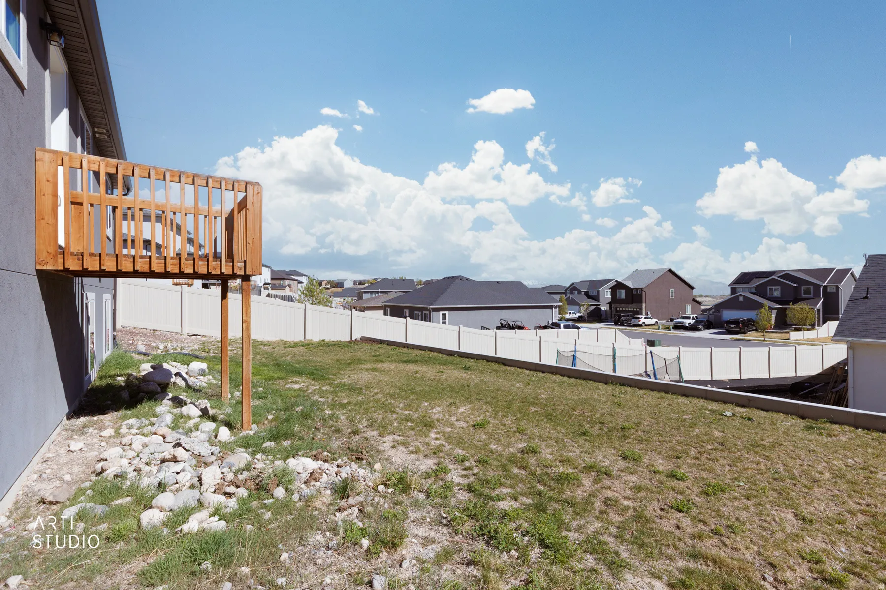 Fenced backyard featuring a residential view