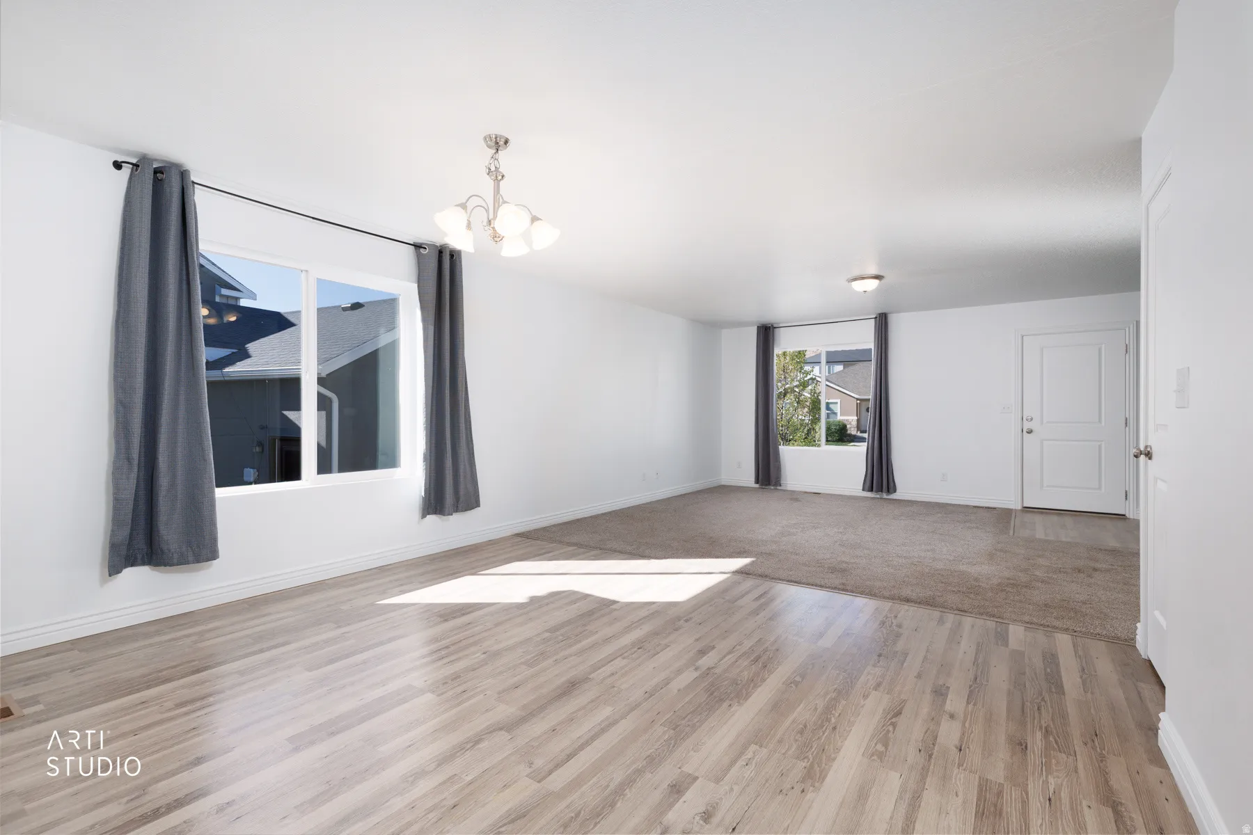 Dining room featuring hanging lights and light wood-style floors