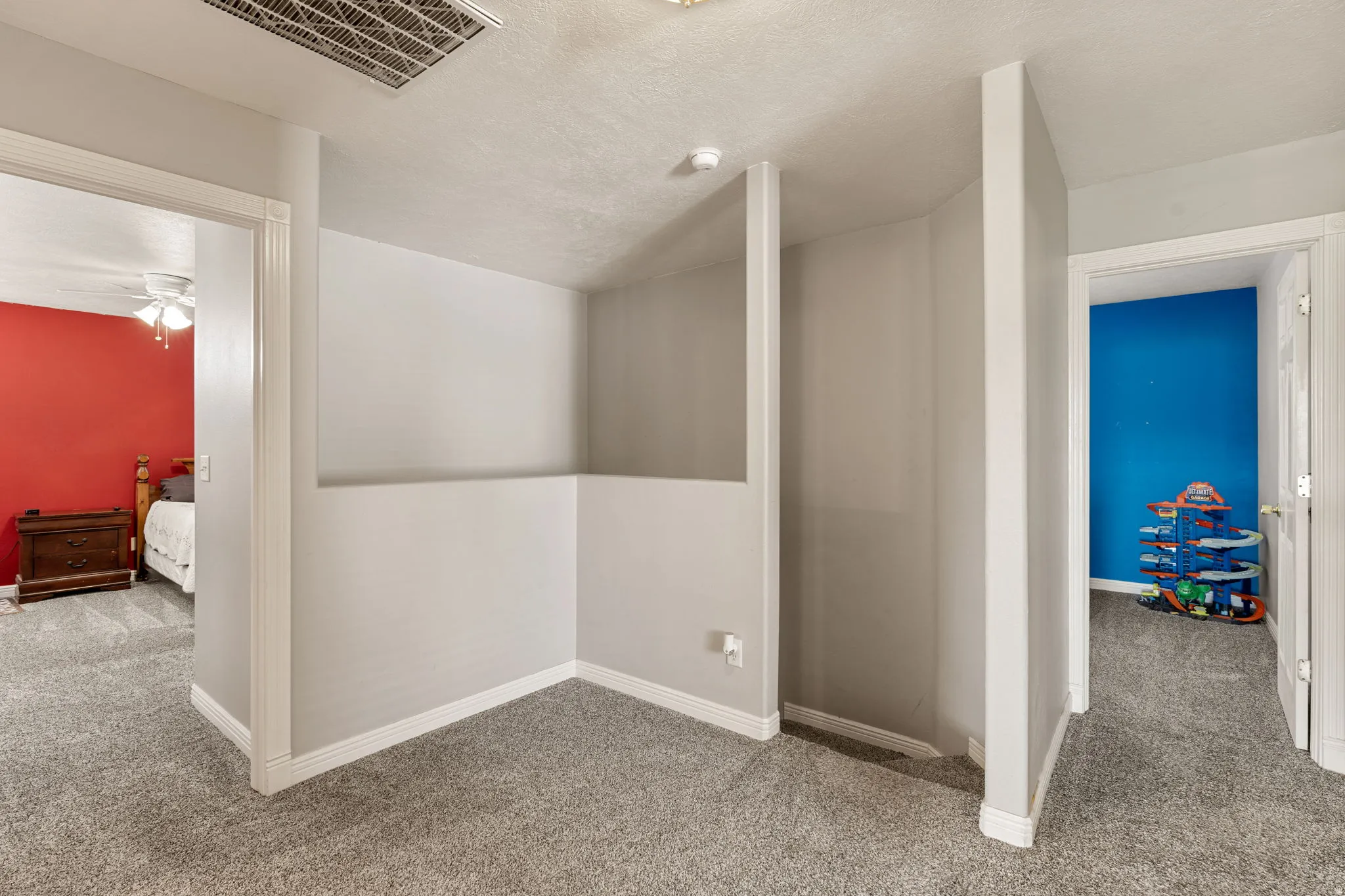 Bonus room featuring carpet and a ceiling fan