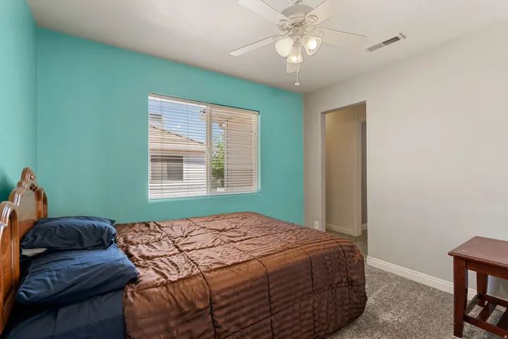 Bedroom with carpet floors and ceiling fan