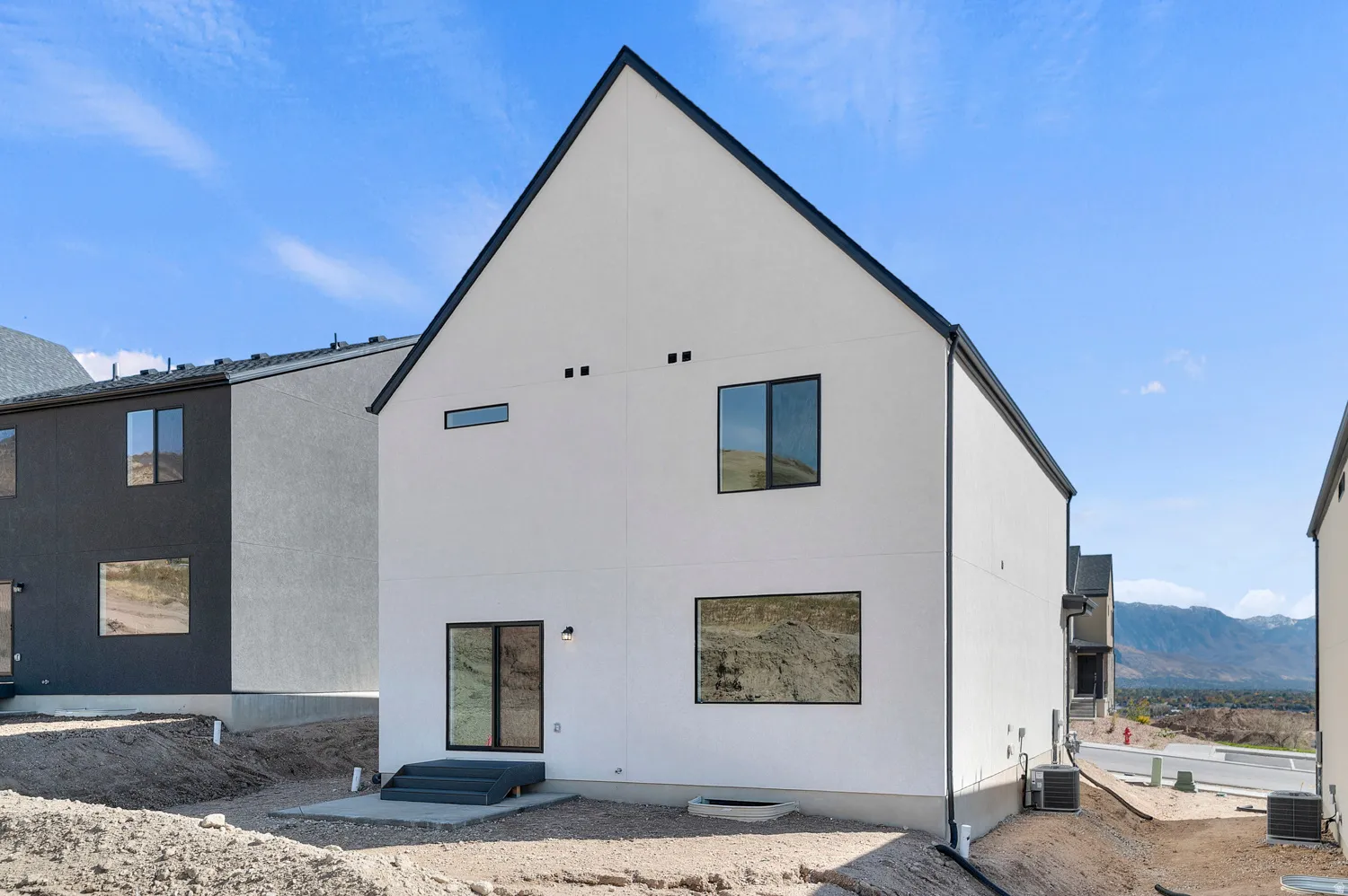 Rear view of property with a mountain view