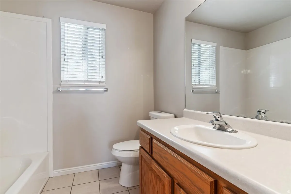 Bathroom featuring vanity and light tile patterned flooring