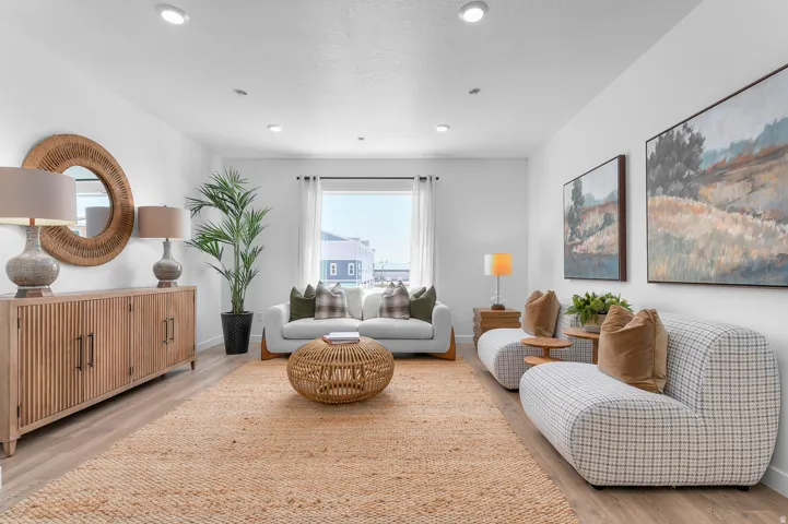 Sitting room featuring light wood-style flooring and baseboards