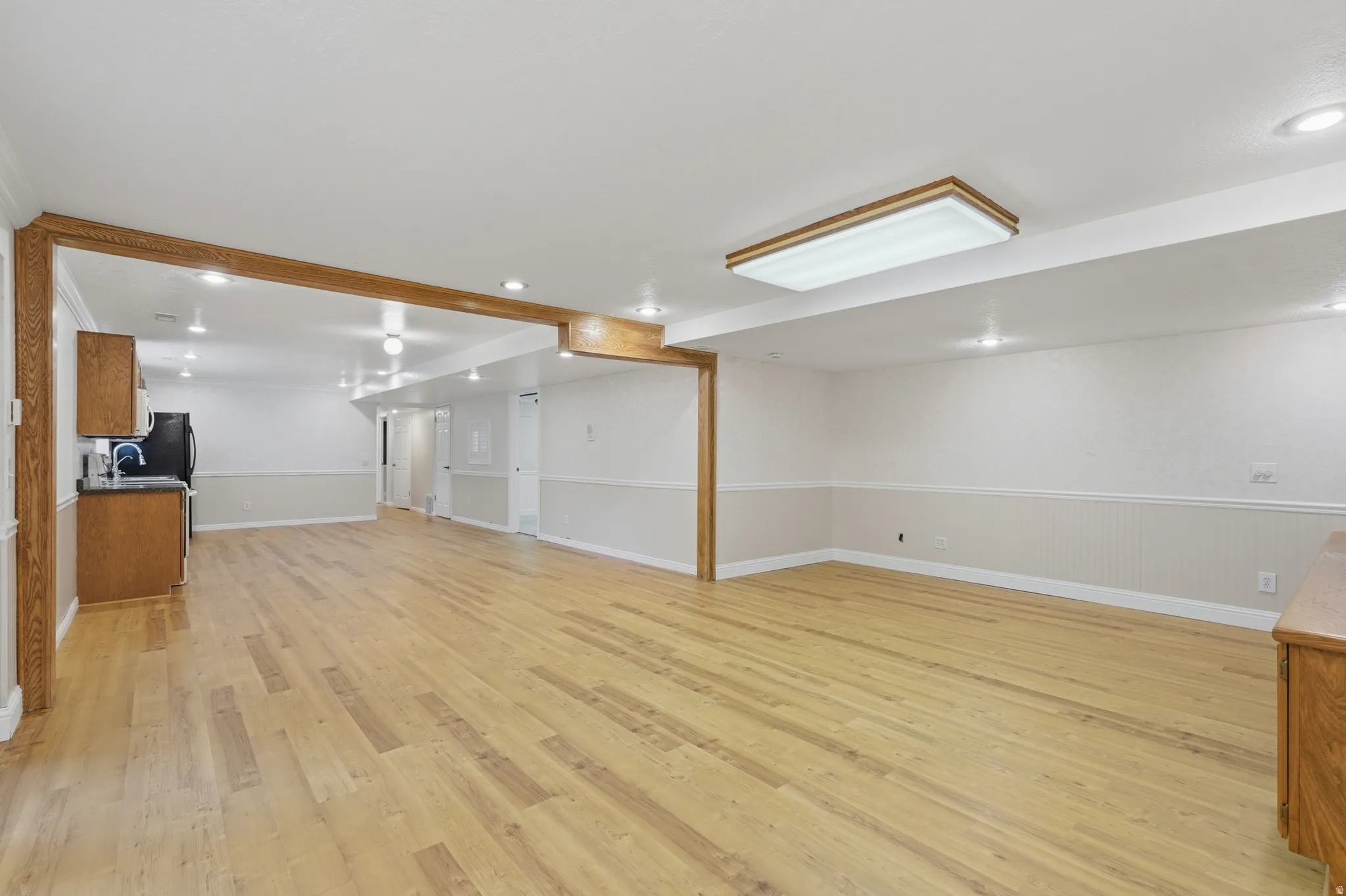 Basement family room looking towards second kitchen (possible ADU)