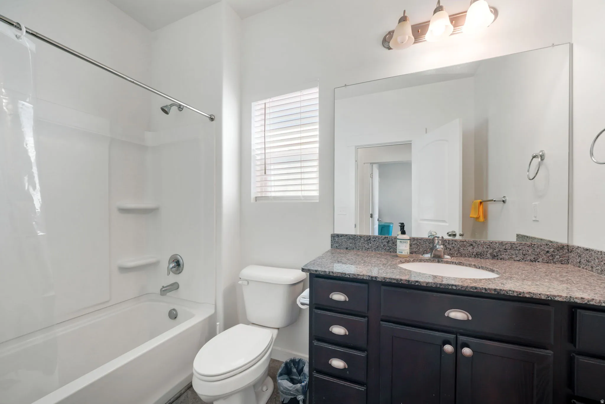 Full bath with vanity and shower / bathtub combination with curtain