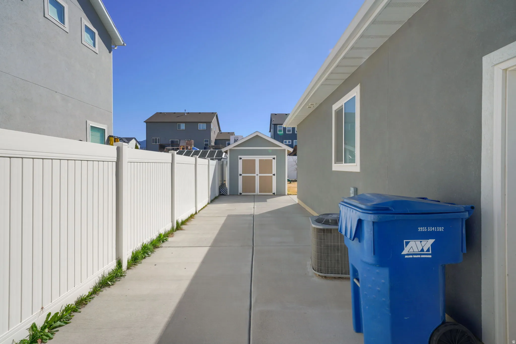 View of side of house / terrace featuring a storage unit