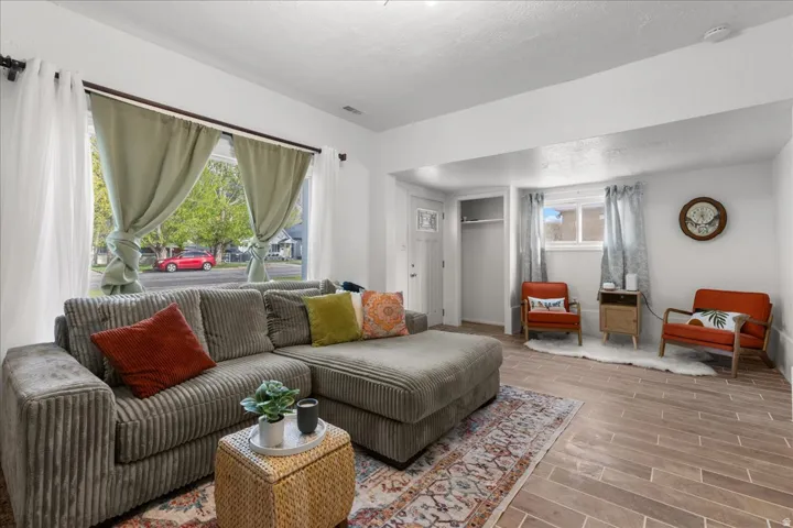 Living room featuring wood finish floors and a textured ceiling