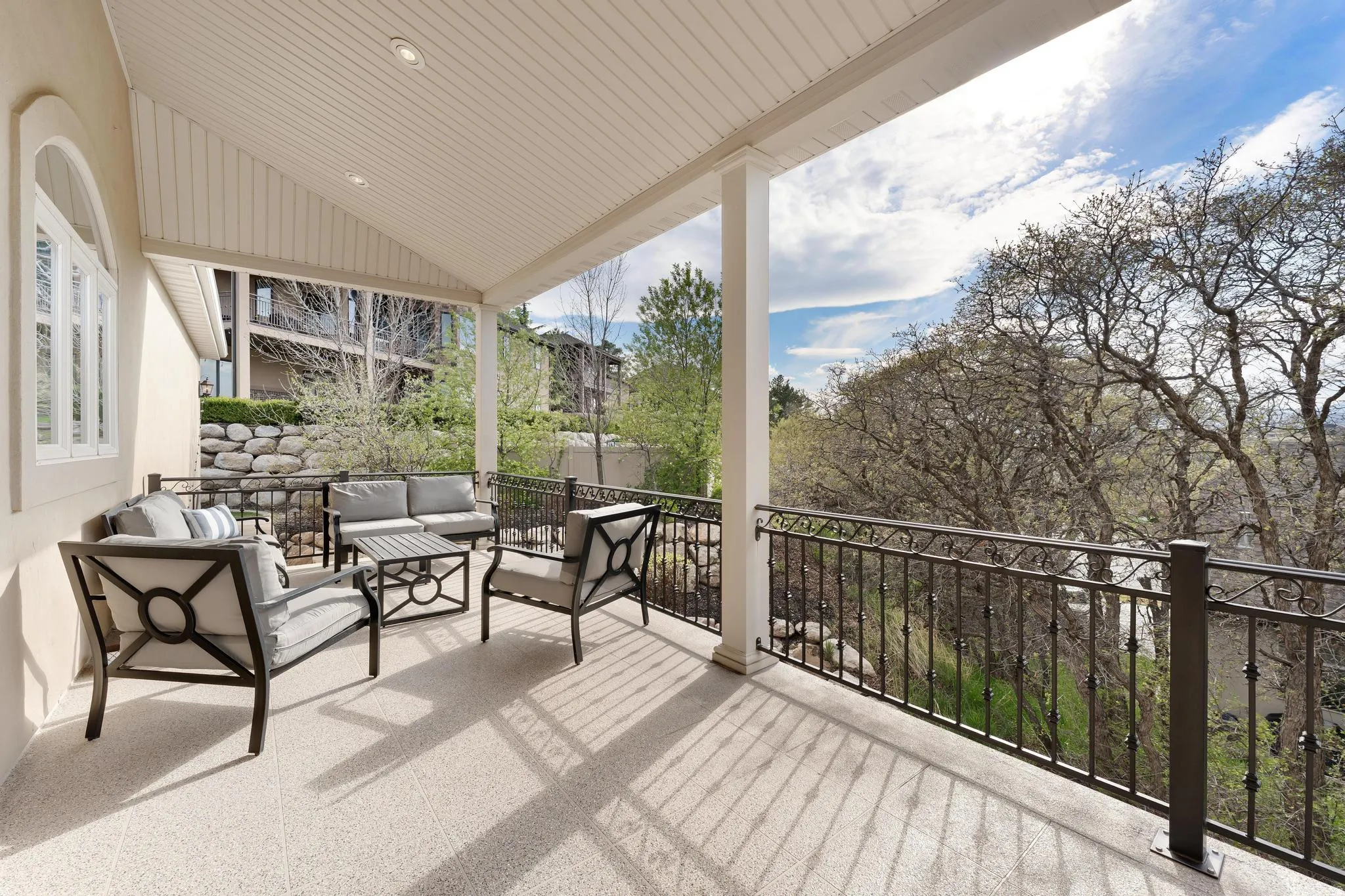 Wooden deck featuring an outdoor living space and a patio