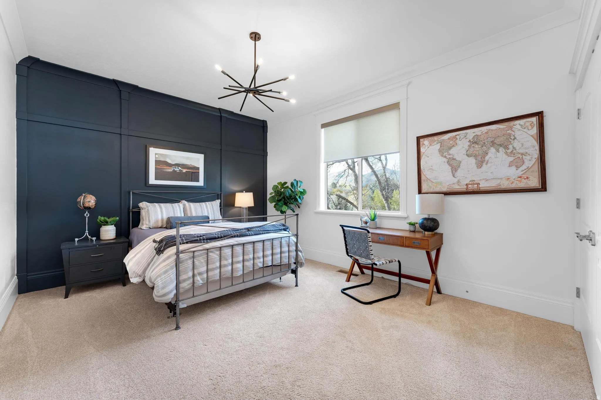 Bedroom featuring light carpet and hanging lights
