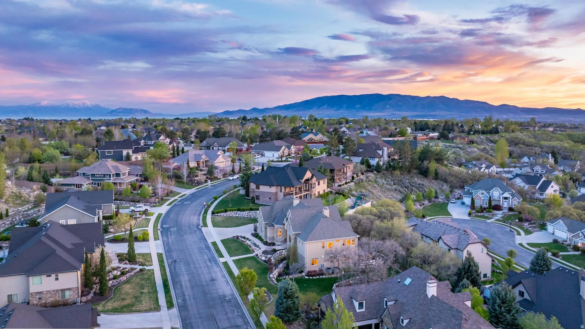 Aerial view at dusk of a residential view and a mountain view