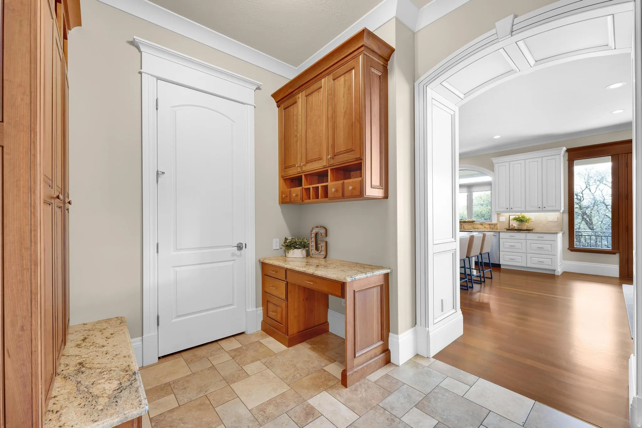 Hallway featuring an office area, crown molding, and recessed lighting