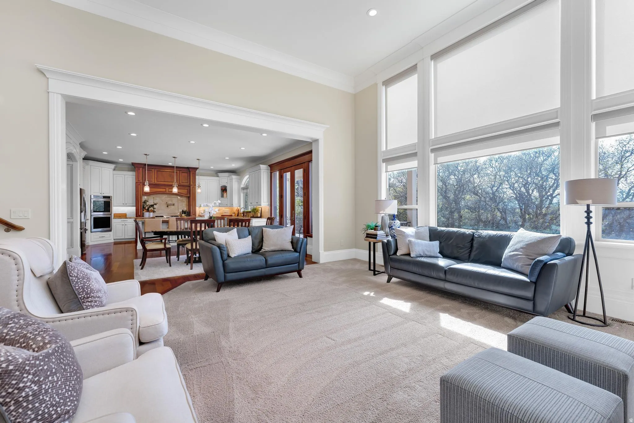 Living room featuring recessed lighting and ornamental molding
