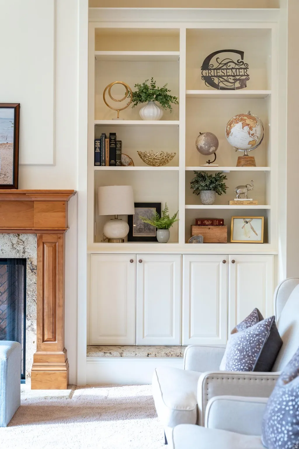 Detailed view of built in shelves and a premium fireplace