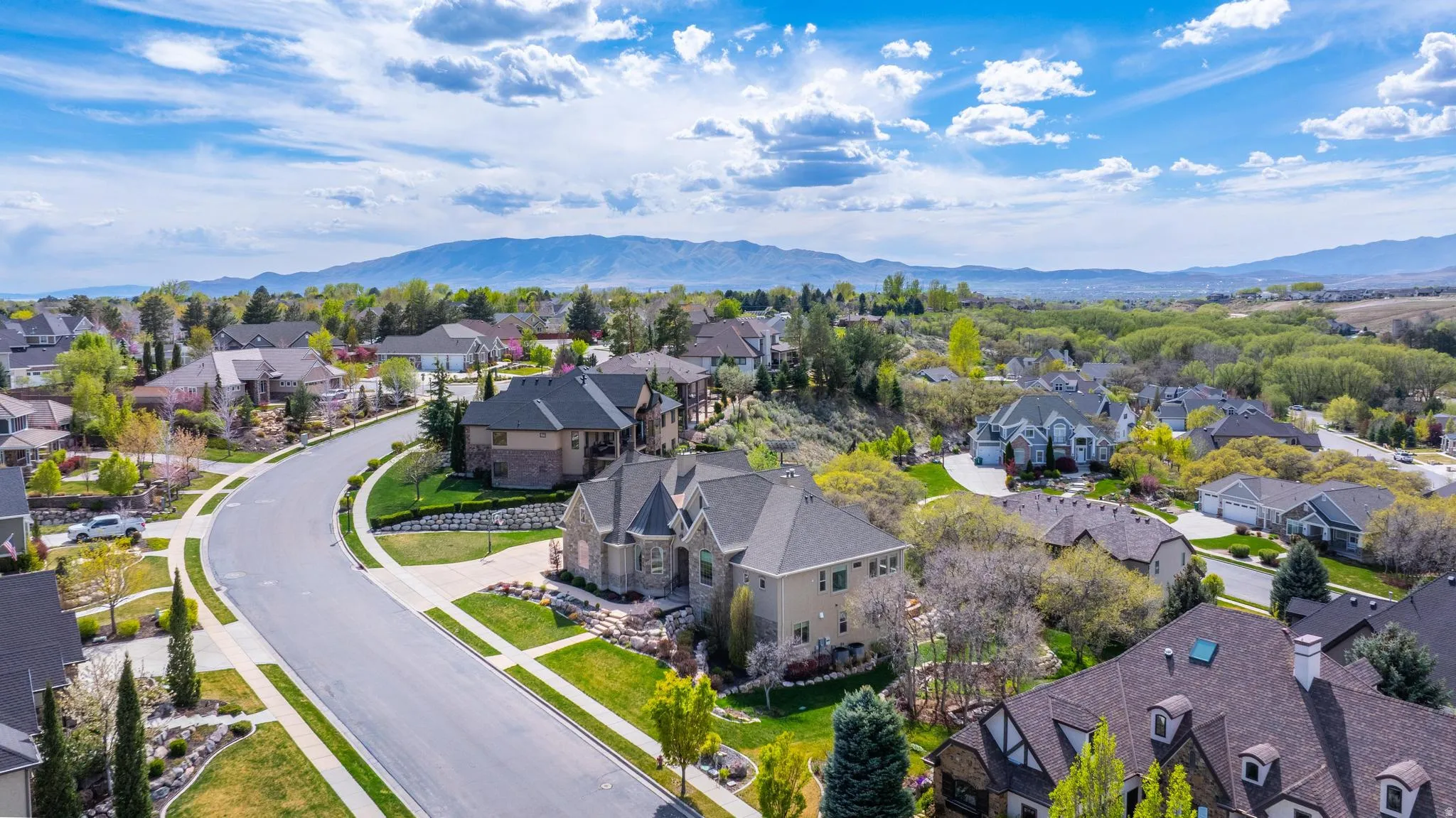 Aerial perspective of suburban area featuring a mountainous background