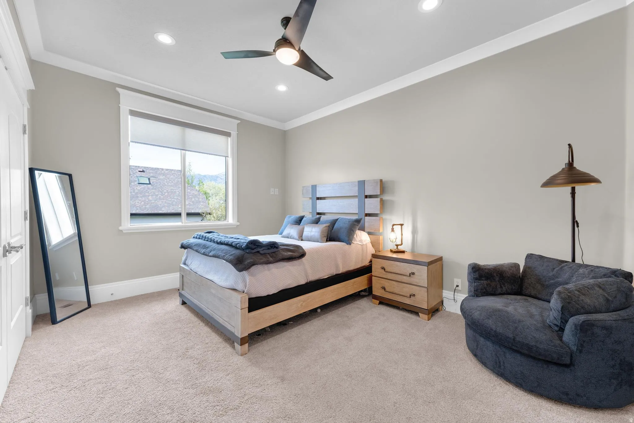 Bedroom featuring ornamental molding, light carpet, ceiling fan, and recessed lighting