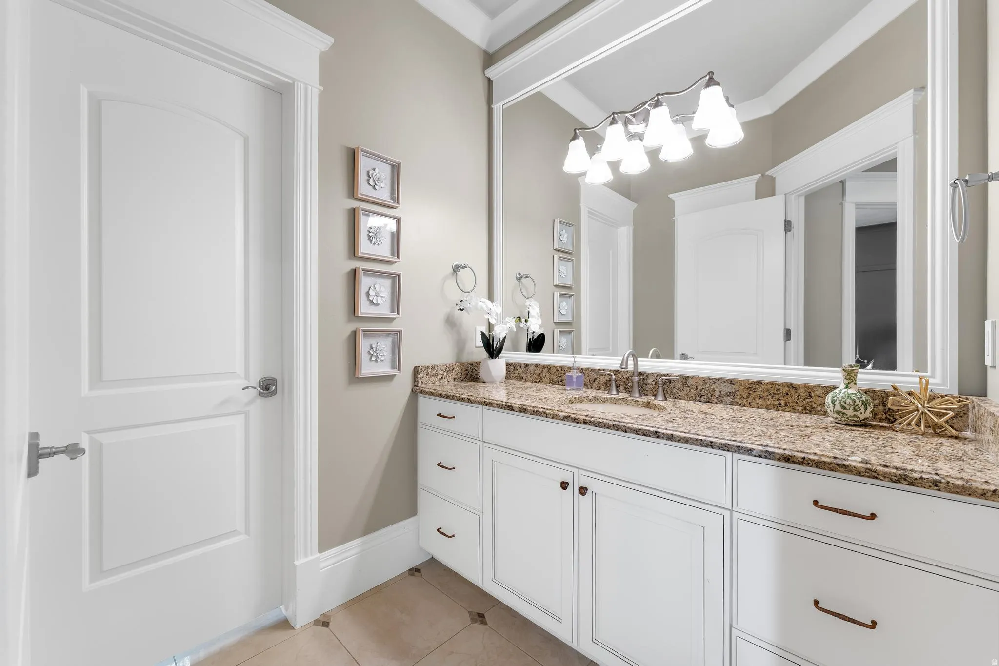 Bathroom featuring vanity and light tile patterned flooring
