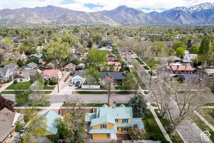 Aerial perspective of suburban area featuring a mountain backdrop