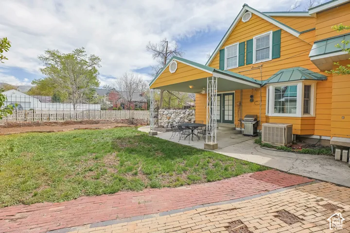 Rear view of property featuring french doors