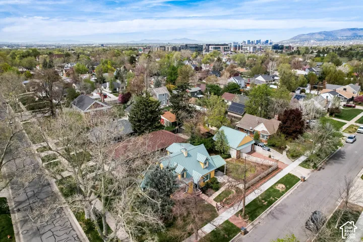 Aerial perspective of suburban area featuring a mountainous background